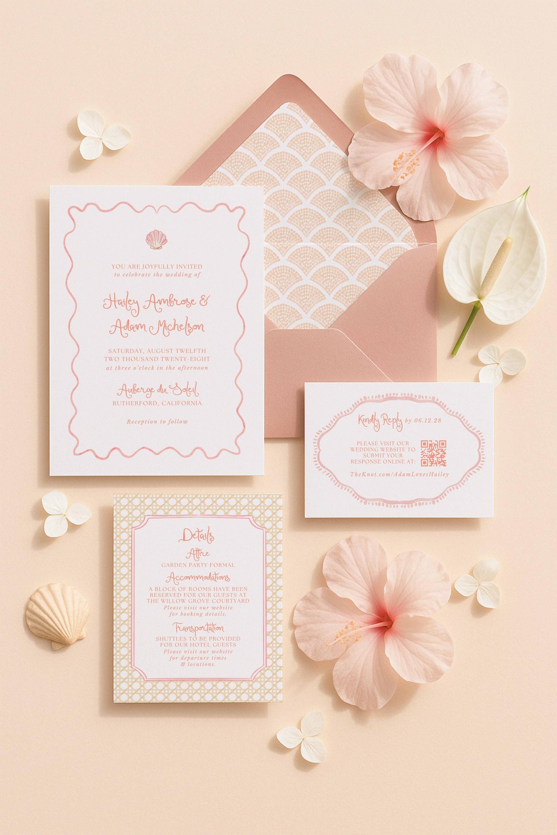 a wedding invitation with a pink and white color scheme, surrounded by various floral elements and small decorative items.