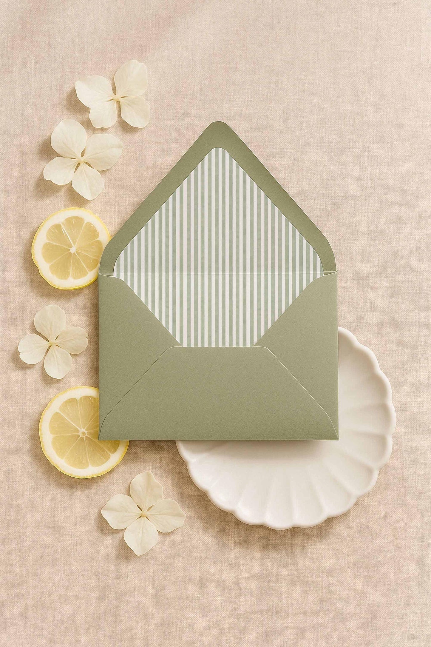 A7 envelope with green watercolor stripe printable liner surrounded by soft florals and citrus styling.