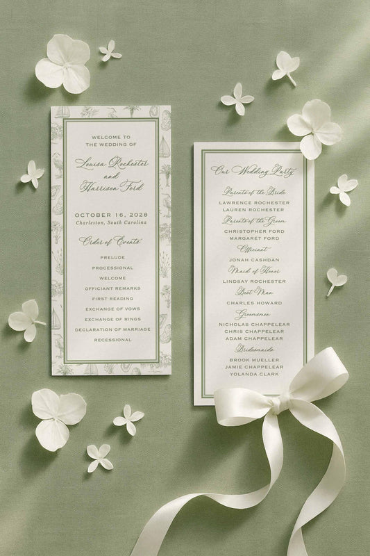 Southern toile wedding ceremony programs displayed on a sage green linen background with scattered white hydrangea petals and a satin ribbon. The programs feature a hand-drawn coastal toile border with illustrations of palmettos, egrets, oysters, marsh grasses, oak trees, and sailboats. Elegant fine art stationery showing an order of events and wedding party details. Printable Canva-editable program card for coastal, southern, or Lowcountry weddings.
