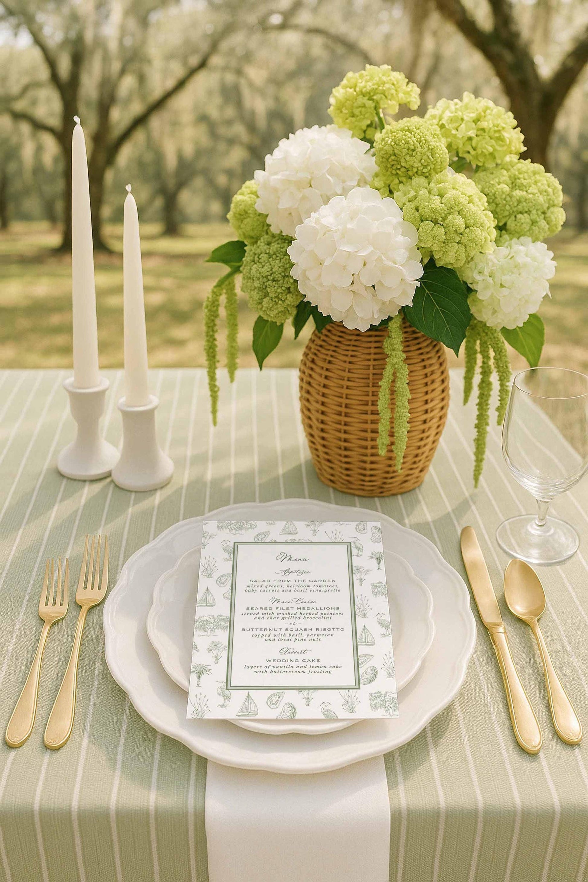 Southern toile wedding menu with hand-drawn coastal motifs and fine art illustrations. Green and white wedding tablescape.