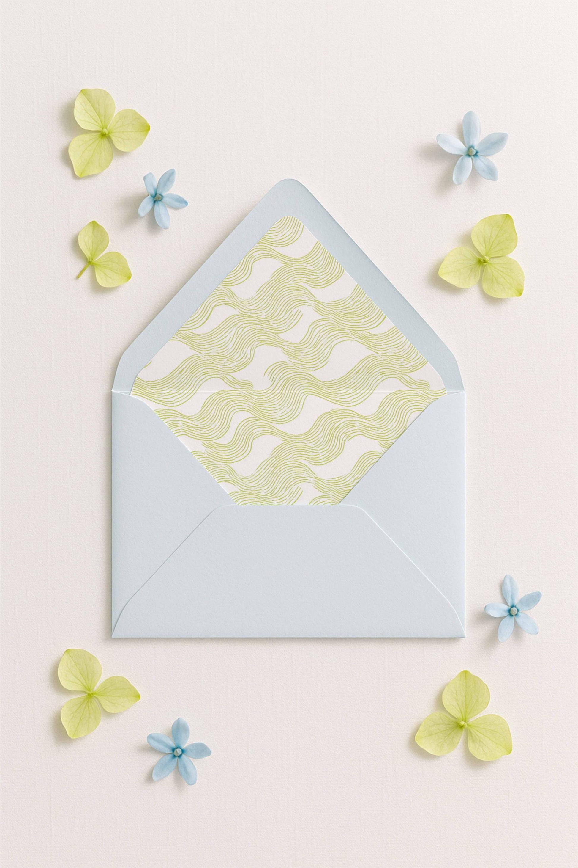 a light blue envelope with a yellow and white patterned design, surrounded by small blue and yellow flowers on a light pink background.