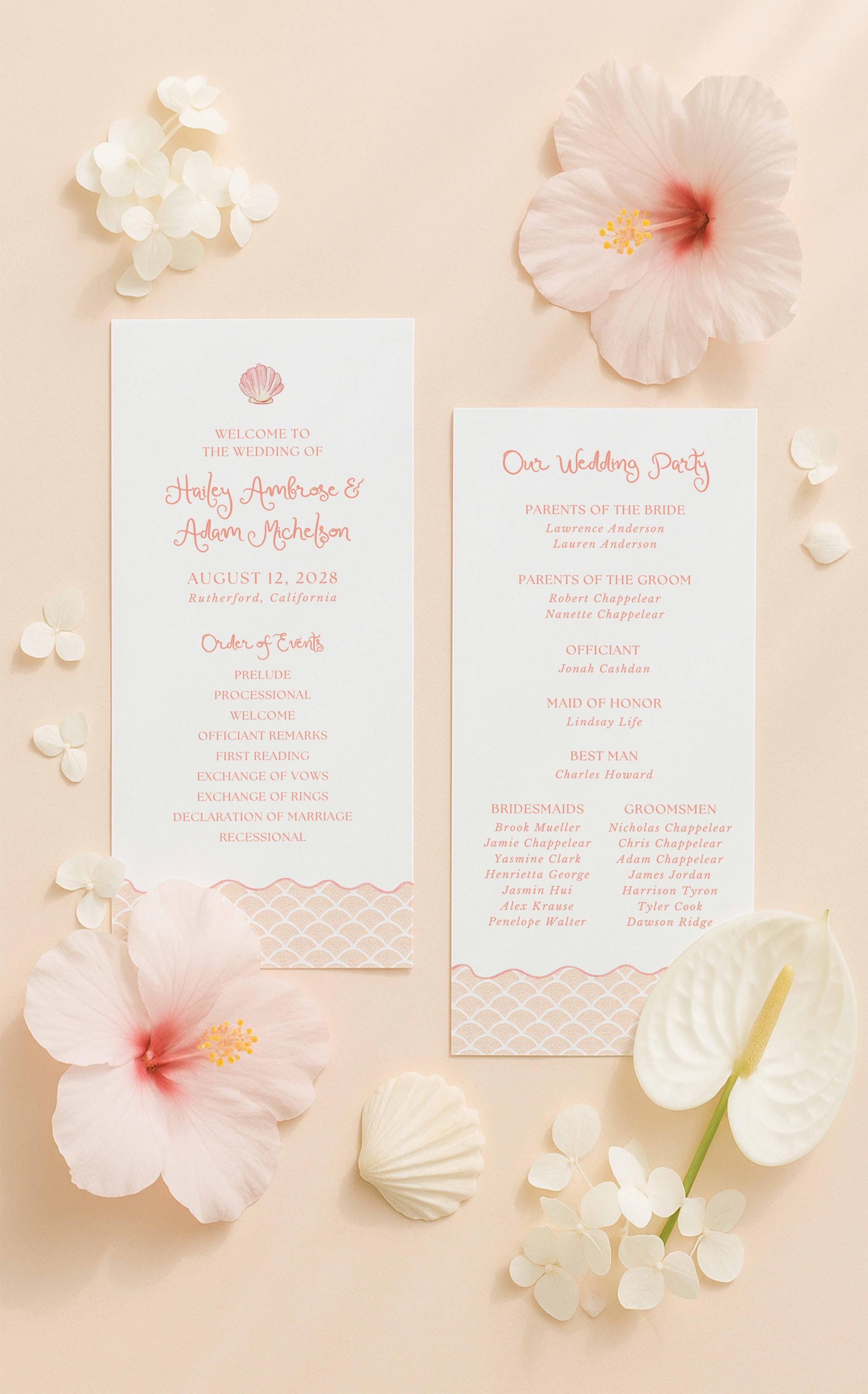a wedding invitation card with a pink and white color scheme, surrounded by white flowers and seashells.