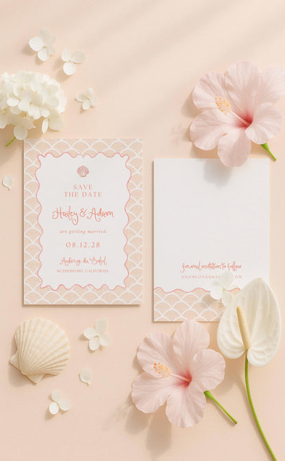 a wedding invitation card with a pink and white color scheme, surrounded by various floral elements such as hibiscus flowers, seashells, and a white flower.