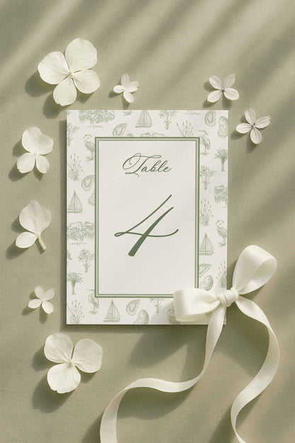 Coastal southern toile table number featuring palmetto, egret, oyster, and marsh elements