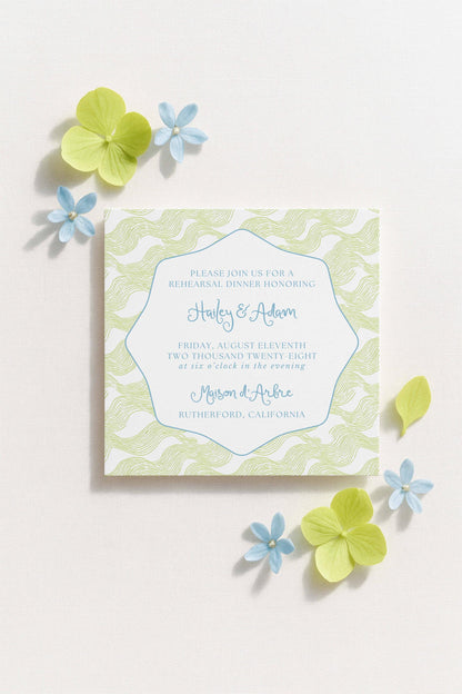 The image is a wedding invitation card with a light green and white color scheme, featuring a floral design and text inviting guests to a rehearsal dinner.