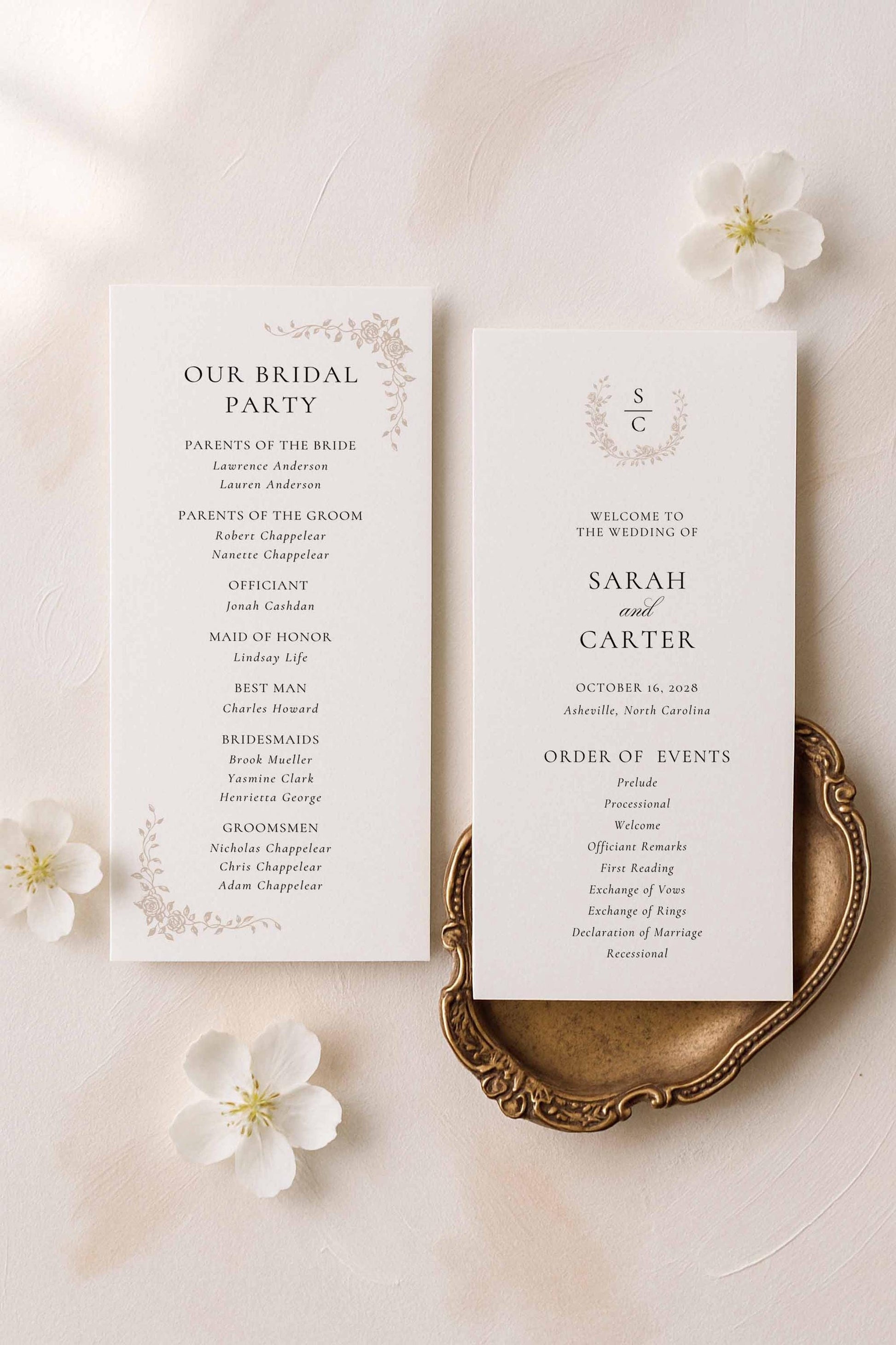 Tall neutral wedding ceremony program with delicate floral line art placed on an elegant ivory and beige flat lay scene.