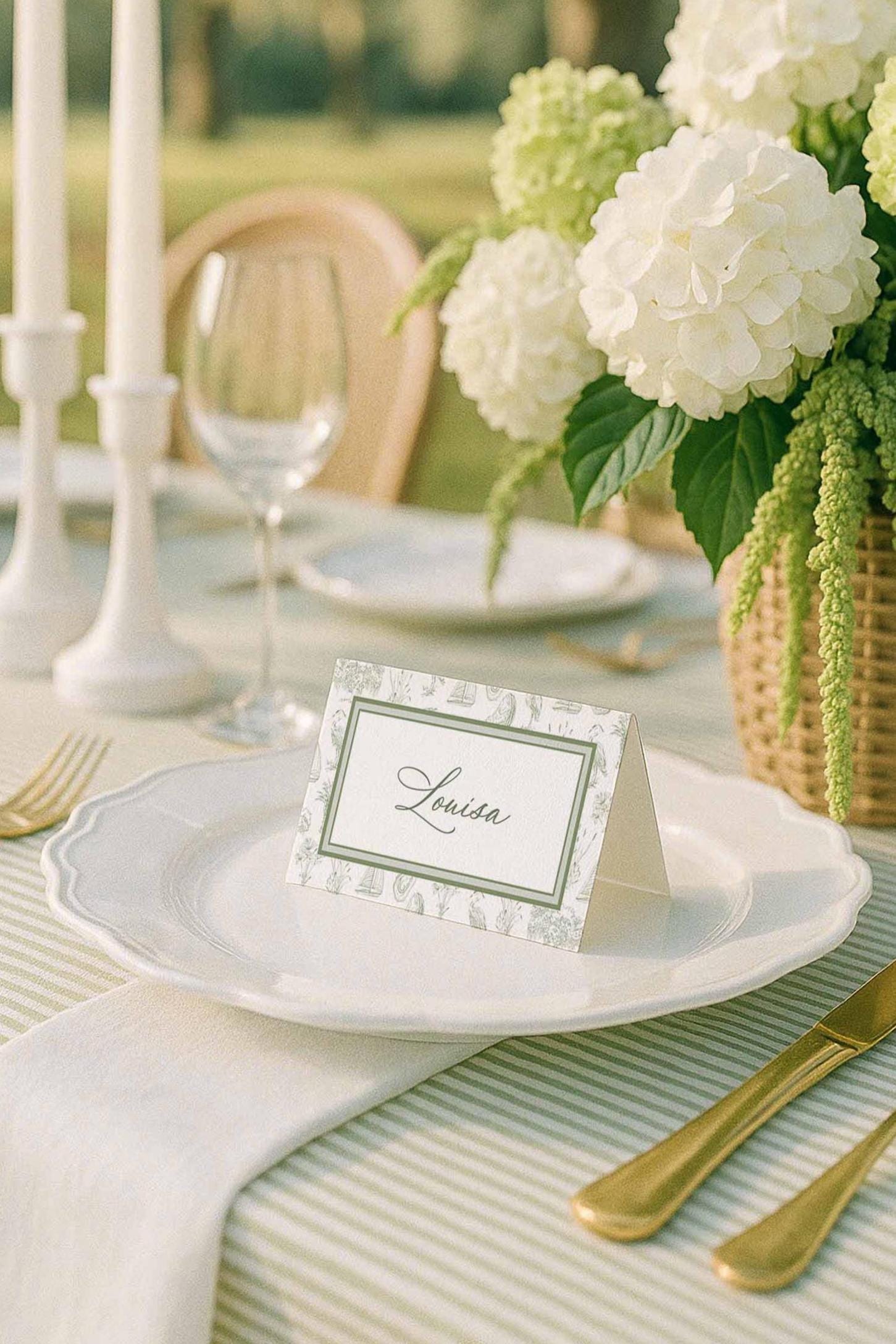 Southern toile place cards with hand-drawn palmetto, egret, oyster, marsh grass, and oak tree icons