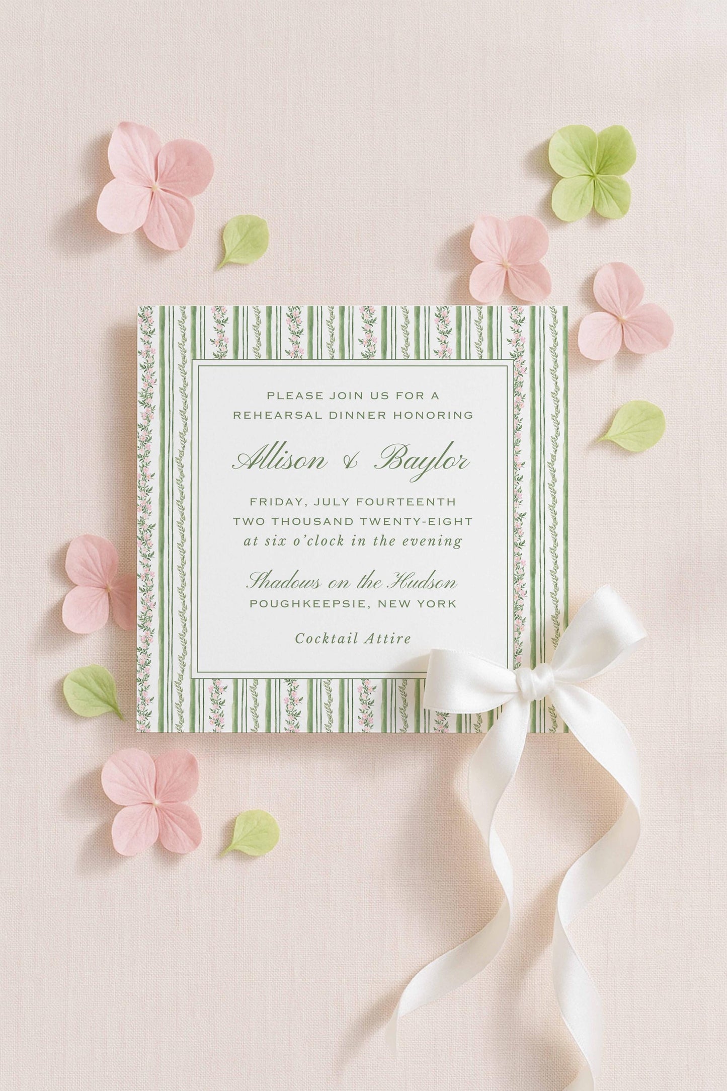 a formal invitation card with a green and white striped design, surrounded by pink and green flowers and leaves.