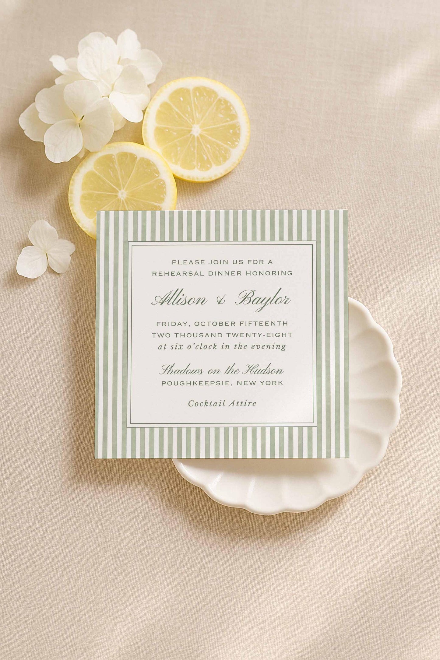 Green watercolor stripe rehearsal dinner invitation surrounded by lemons and soft neutral florals.