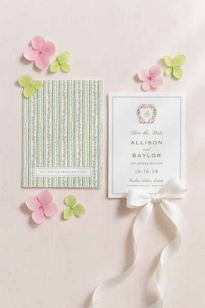 a wedding invitation card with a green and white striped pattern, a white card with a floral design, and pink and green flowers surrounding the cards.