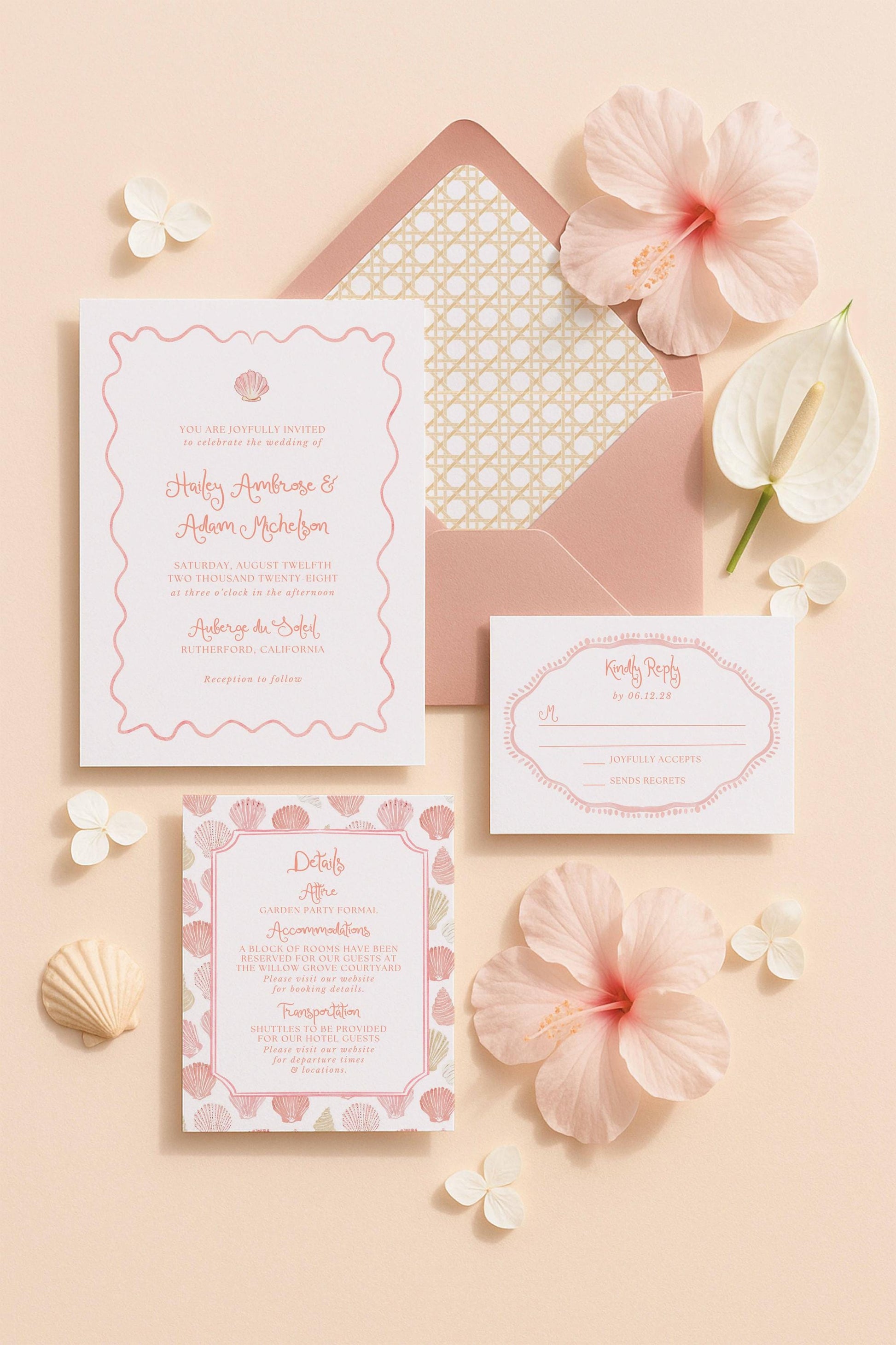 a wedding invitation with a pink and white color scheme, surrounded by various floral elements and small decorative items.