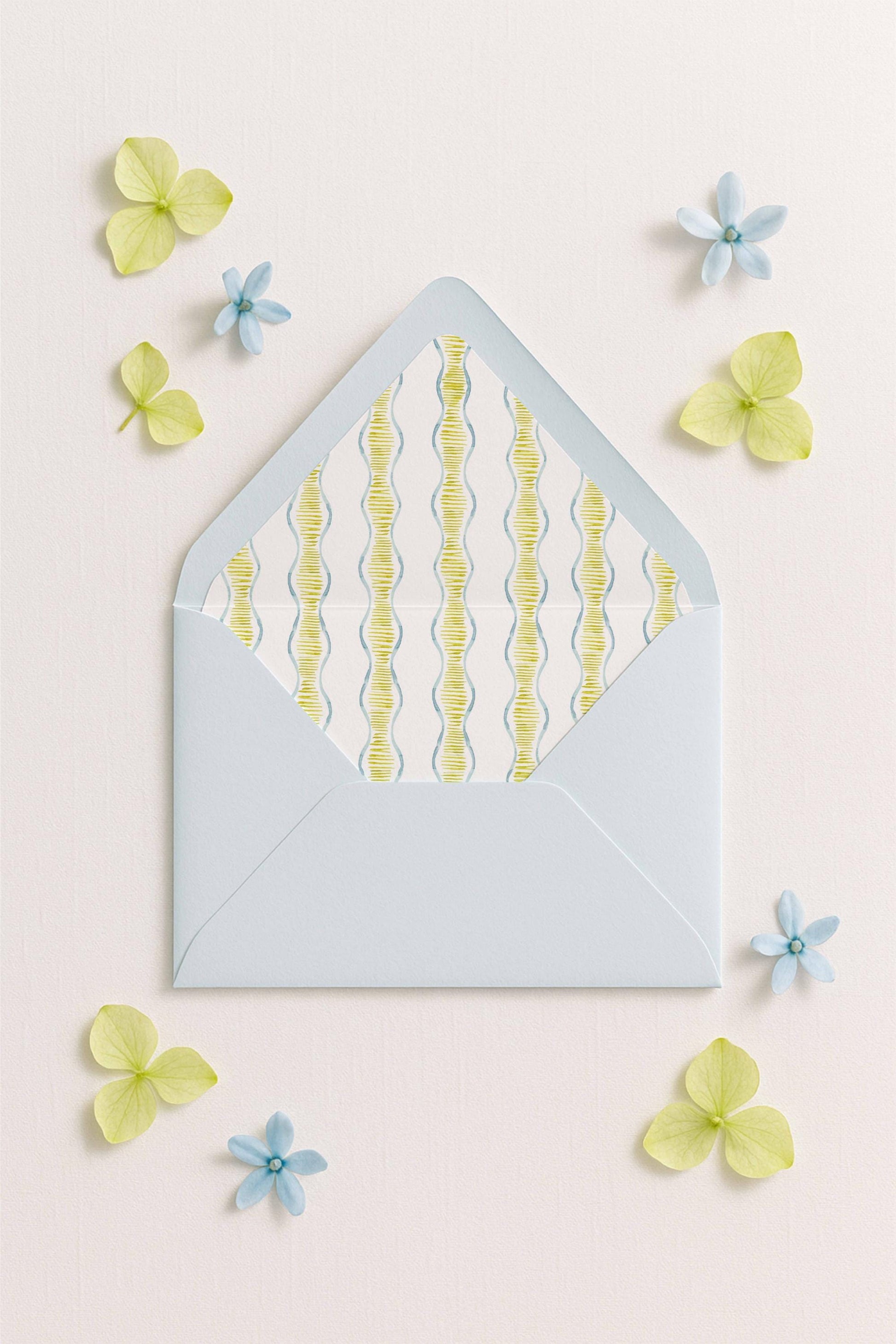 a light blue envelope with a pattern of yellow and blue lines, surrounded by small blue and yellow flowers on a light pink background.