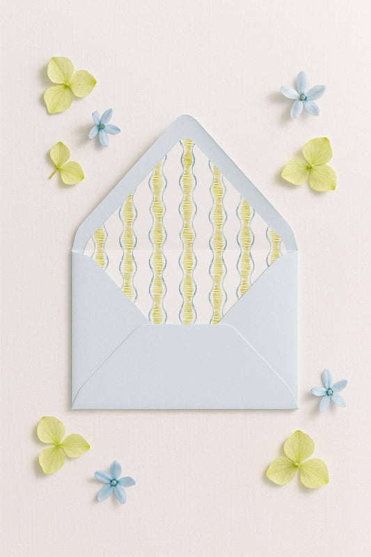 a light blue envelope with a pattern of yellow and blue lines, surrounded by small blue and yellow flowers on a light pink background.