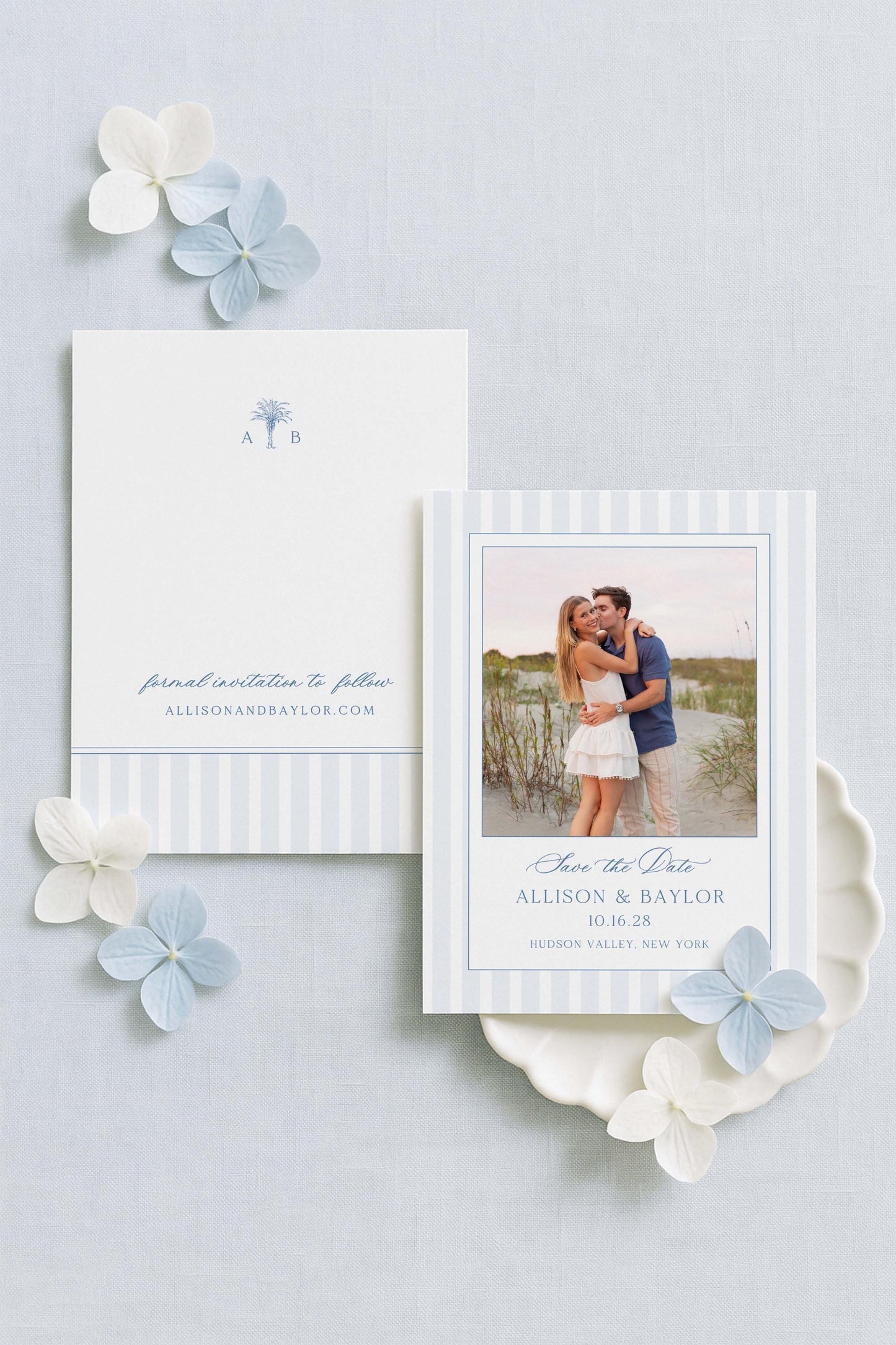 a couple embracing in a photograph, surrounded by a white card with text and a blue flower.