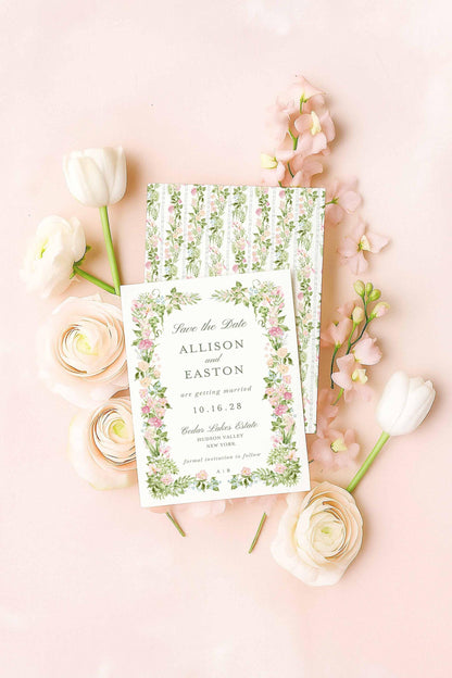 A floral watercolor Save the Date card with matching patterned backer, styled flat-lay on a blush background with ranunculus and tulips.
