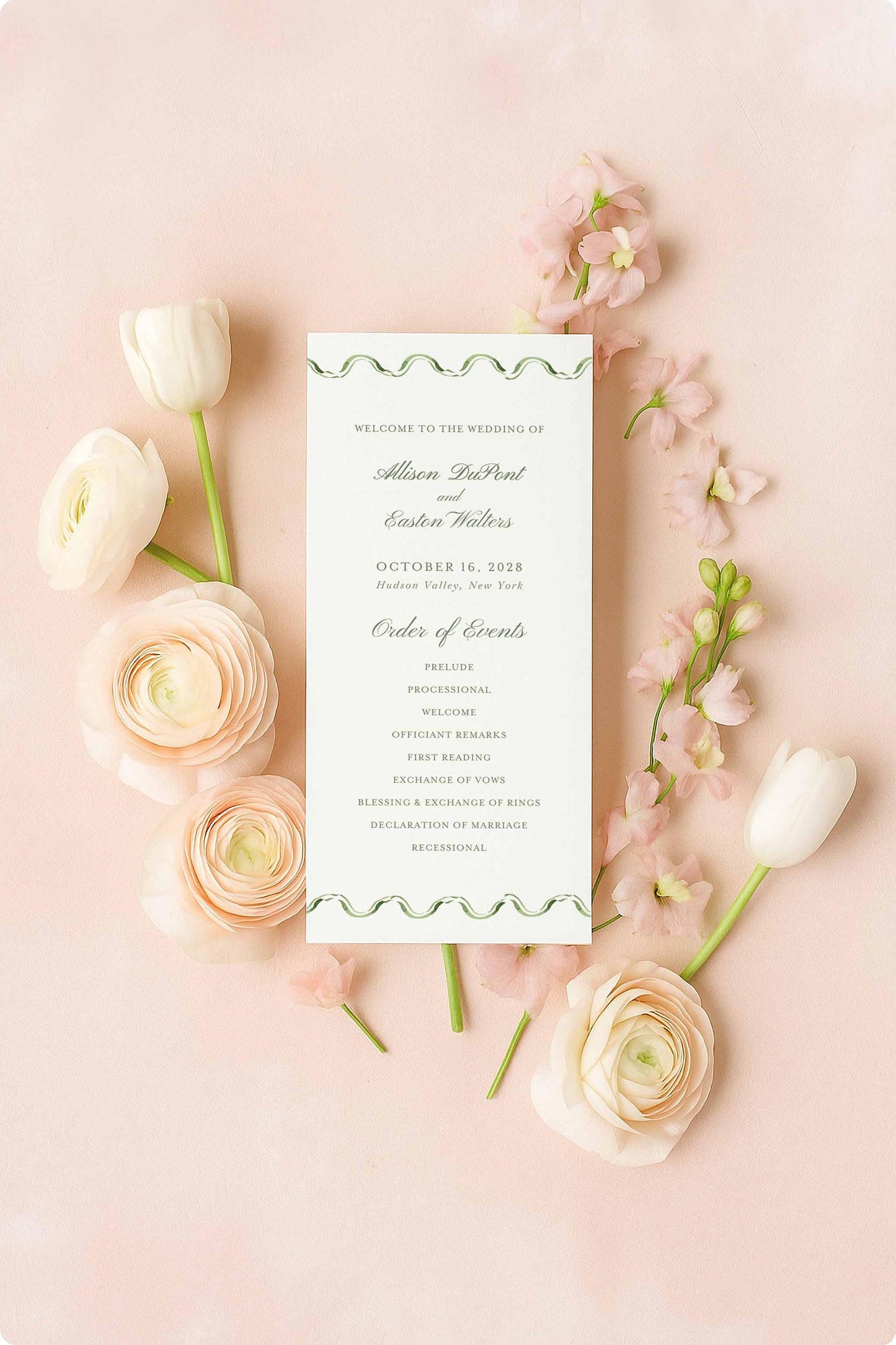 a wedding invitation card surrounded by pink roses and white tulips on a pink background.