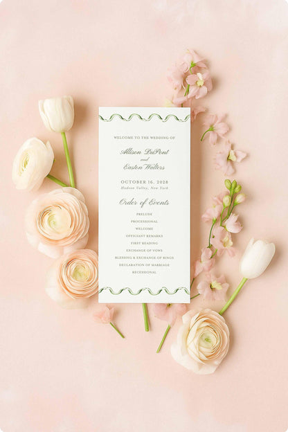 a wedding invitation card surrounded by pink roses and white tulips on a pink background.