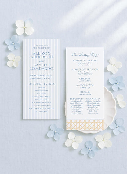 a wedding invitation card with a blue and white color scheme, surrounded by white and light blue flowers.