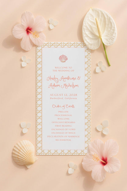 a wedding invitation card surrounded by various floral elements, including pink hibiscus flowers, white orchids, and seashells.